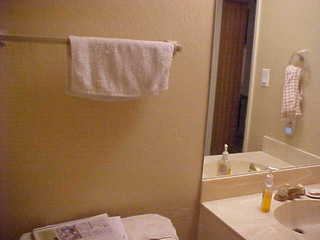 Downstairs powder room with white towel.