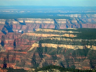 Adam flying over the Grand Canyon (background indistinct)