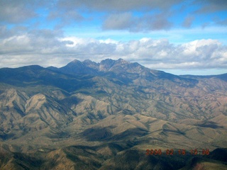 1666 5qj. aerial -- Four Peaks in clouds
