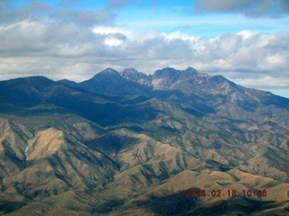 1667 5qj. aerial -- Four Peaks in clouds
