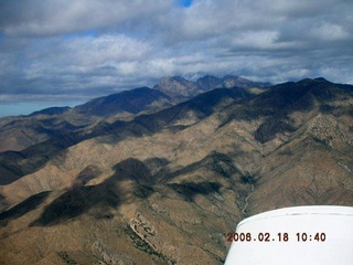 1668 5qj. aerial -- Four Peaks in clouds