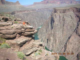 94 5t8. Plateau Point -- Mighty Colorado River -- Adam on rock ledge