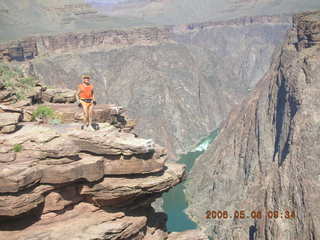 95 5t8. Plateau Point -- Mighty Colorado River -- Adam on rock ledge