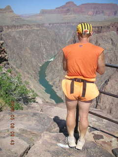 Plateau Point -- Mighty Colorado River -- Adam looking at the ledge