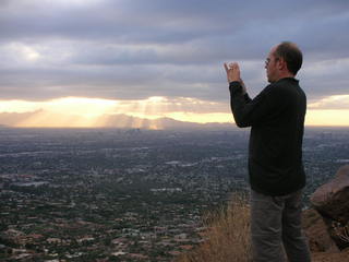Camelback hike -- glorious sun rays in clouds -- Wolfgang taking a picture