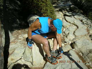 439 61t. Zion National Park - Observation Point hike - Adam putting on crampons