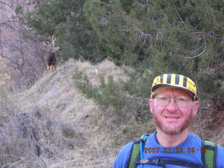 485 61u. Zion National Park - Adam with mule deer in the background - Watchman hike