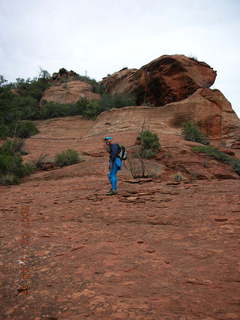 504 62b. Sedona -- Secret Canyon hike -- Adam climbing slickrock