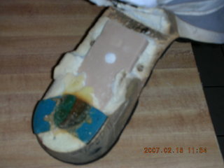 2232 62j. a very old running shoe falling apart