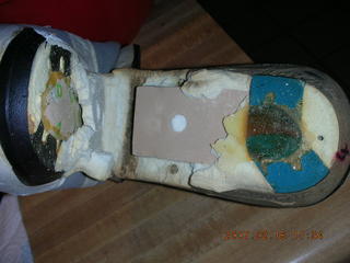 2234 62j. a very old running shoe falling apart