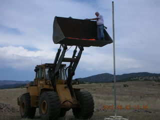 Young -- Chapman Ranch Airport - loader raising Arv for wind sock replacement