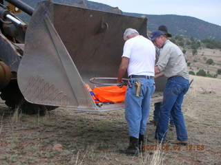 Young -- Chapman Ranch Airport - loader raising Arv and Bob for wind sock replacement