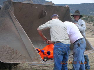 Young -- Chapman Ranch Airport - loader raising Arv and Bob for wind sock replacement