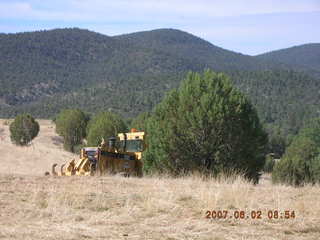 Young -- Chapman Ranch Airport - loader raising Arv and Bob for wind sock replacement