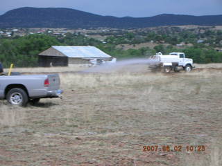 Young -- Chapman Ranch Airport - dump truck in the hangar