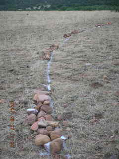 Young -- Chapman Ranch Airport - wind sock circle in rocks