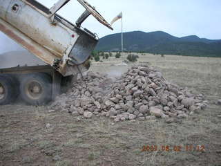 Young -- Chapman Ranch Airport - dump truck dumping rocks for wind sock circle