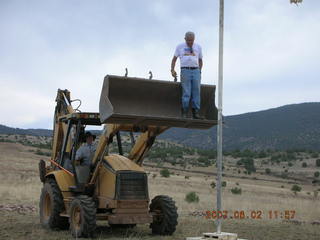 Young -- Chapman Ranch Airport - Arv on loader working on wind sock