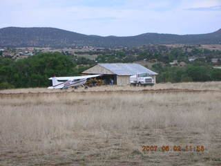 Young -- Chapman Ranch Airport - hangar and airplane