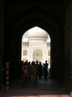 Taj Mahal entrance with main building seen through archway