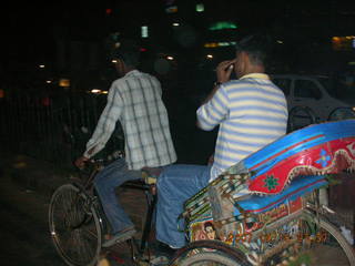 26 69f. Ravi riding a rickshaw in Gurgaon, India