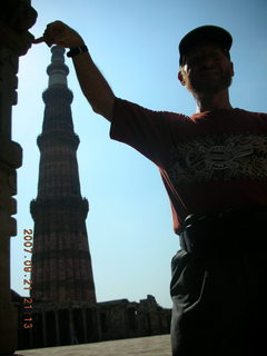 Qutub Minar, Delhi - silhouette of Adam `holding' big tower