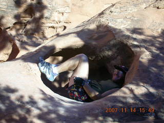 230 6be. Arches National Park - Devils Garden hike - Adam in hole in rock