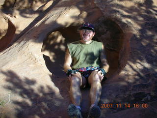Arches National Park - Devils Garden hike - Adam sitting in hole in rock