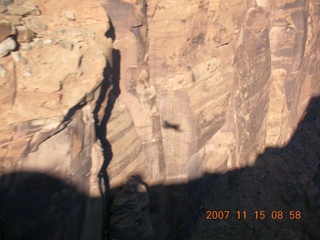 116 6bf. Flying with LaVar Wells - approach canyon to Hidden Splendor (WPT660) - our shadow on canyon wall - aerial