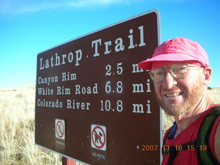 Canyonlands National Park - Lathrop Trail hike - Adam at trailhead sign