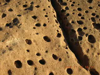 378 6bg. Canyonlands National Park - Grand View Overlook - pitted rock up close