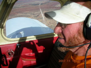 153 6bj. Adam flying N4372J over Utah landscape
