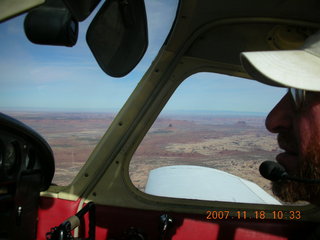 155 6bj. Adam flying N4372J over Utah landscape