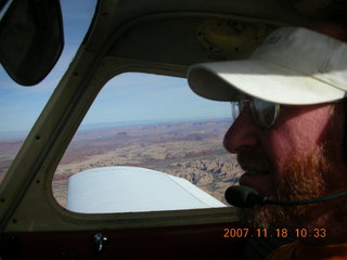 156 6bj. Adam flying N4372J over Utah landscape