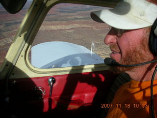 158 6bj. Adam flying N4372J over Utah landscape