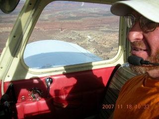 159 6bj. Adam flying N4372J over Utah landscape