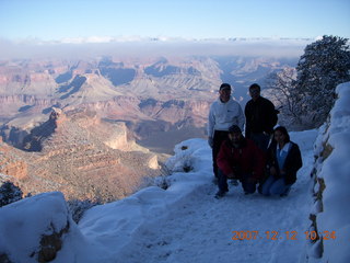 Grand Canyon with snow and clouds - Adam, Hitesh, Nitin, Aditi on trail