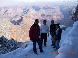 Grand Canyon with snow and clouds - Hitesh, Adam, Nitin, Aditi on trail