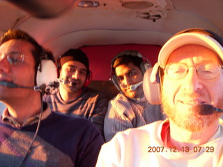 Grand Canyon with snow and clouds - Hitesh, Adam, Nitin, Aditi on trail