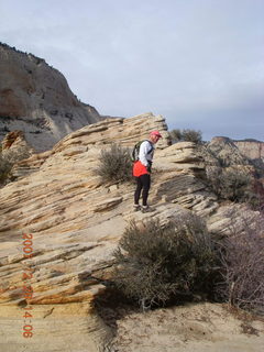 82 6cv. Zion National Park - Angels Landing hike - Adam climbing at the top