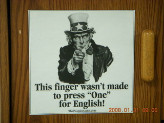 2389 6dx. 'This finger wasn't made to press `One' for English' sign