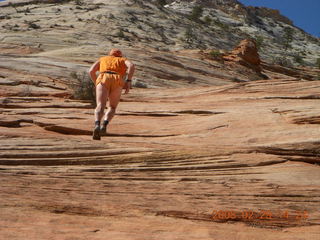 94 6ev. Zion National Park - slickrock hill - Adam going up