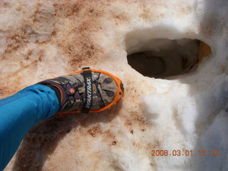 224 6f1. Bryce Canyon - Navajo Loop hike - my foot with Yaktrax and deep footprint