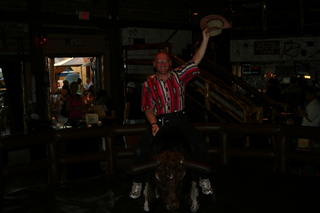 Saddle Ranch Adam posing on the bull (dark)