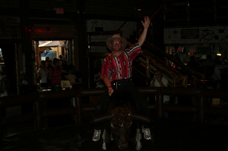 Saddle Ranch Adam posing on the bull (dark)