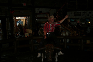 Saddle Ranch Adam posing on the bull (dark)