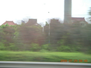 39 6kv. eclipse - Shanghai - houses seen from moving bus