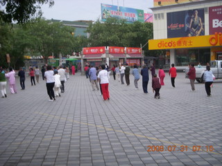 67 6kx. eclipse - Jiuquan - morning run - people doing Tai Chi