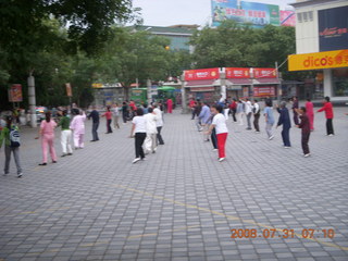 68 6kx. eclipse - Jiuquan - morning run - people doing Tai Chi
