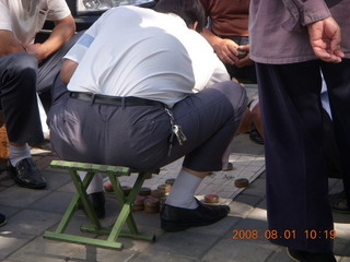 101 6l1. eclipse - Jiuquan -  guys playing board game